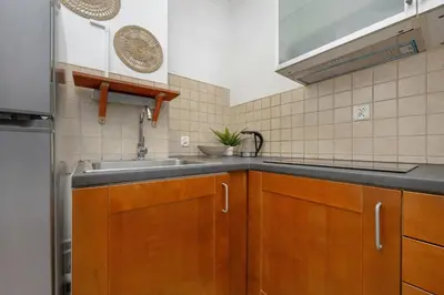 Kuchnia lub aneks kuchenny w obiekcie Beautiful & Bright Walowa Apartments with Balcony by Noclegi Renters