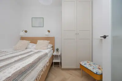 Łóżko lub łóżka w pokoju w obiekcie Beautiful & Bright Walowa Apartments with Balcony by Noclegi Renters