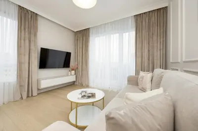 Telewizja i/lub zestaw kina domowego w obiekcie Stylish Apartment with Balcony 7th Floor by Noclegi Renters