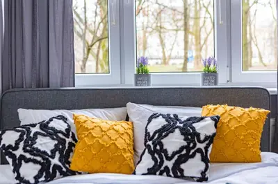 Łóżko lub łóżka w pokoju w obiekcie Apartament Powiśle
