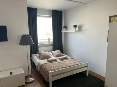 Łóżko lub łóżka w pokoju w obiekcie Apartament Modlińska