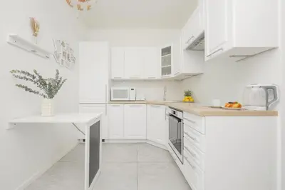 Kuchnia lub aneks kuchenny w obiekcie Business Studio Sikorskiego by Noclegi Renters