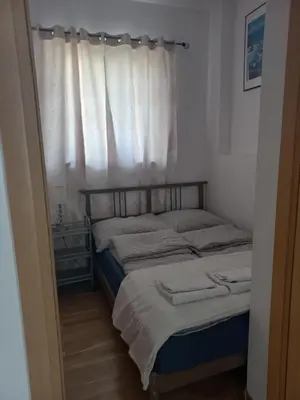 Łóżko lub łóżka w pokoju w obiekcie Royal Park Apartament