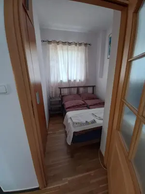 Łóżko lub łóżka w pokoju w obiekcie Royal Park Apartament