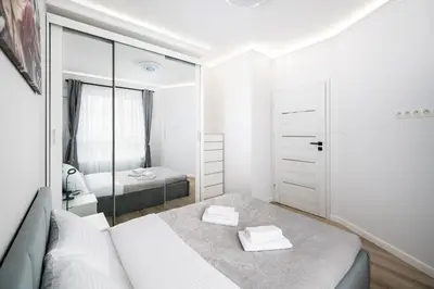 Łóżko lub łóżka w pokoju w obiekcie Mokotów Nowe Południe Chic Apartment by BookingHost