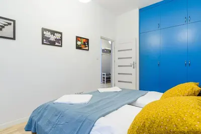 Łóżko lub łóżka w pokoju w obiekcie ShortStayPoland Jana Kazimierza (B155)