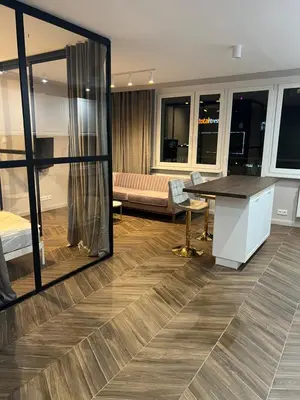 Łóżko lub łóżka w pokoju w obiekcie Wiatraczna Glamour Apartment