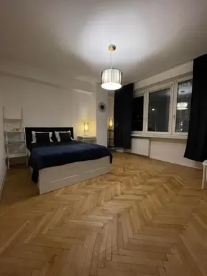 Łóżko lub łóżka w pokoju w obiekcie Apartament Plac Unii Lubelskiej