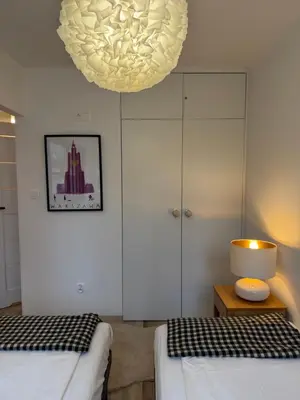 Łóżko lub łóżka w pokoju w obiekcie Apartament Centrum Warszawy Pereca