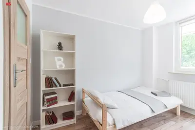 Łóżko lub łóżka w pokoju w obiekcie SuperApart Starościńska ROOMs