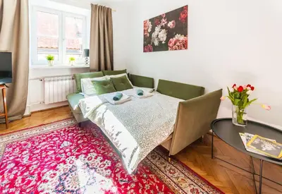 Łóżko lub łóżka w pokoju w obiekcie SuperApart Świętojańska 19, Old Town