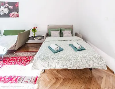 Łóżko lub łóżka w pokoju w obiekcie SuperApart Świętojańska 19, Old Town