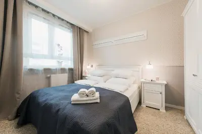 Łóżko lub łóżka w pokoju w obiekcie Cybernetyki 2C P&O Serviced Apartments