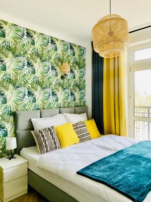 Łóżko lub łóżka w pokoju w obiekcie Olivia Apartments - Słoneczny apartament w centrum Warszawy, Plac Unii Lubelskiej, Łazienki Królewskie, Pole Mokotowskie - 24h check-in