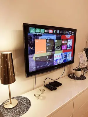Telewizja i/lub zestaw kina domowego w obiekcie HomeComfort Apartament Gulia