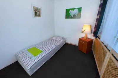 Łóżko lub łóżka w pokoju w obiekcie Wilanowska Hostel