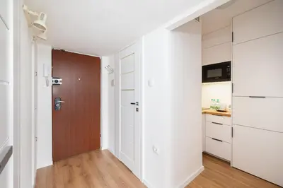 Kuchnia lub aneks kuchenny w obiekcie Krasiński Garden Comfort Apartment by BookingHost
