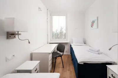 Łóżko lub łóżka w pokoju w obiekcie Krasiński Garden Comfort Apartment by BookingHost