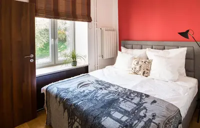 Łóżko lub łóżka w pokoju w obiekcie HelloWarsaw Super central Apt close to Chopin Museum