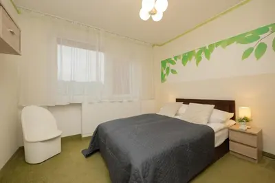 Łóżko lub łóżka w pokoju w obiekcie Apartment with Balcony for 2 People in Warsaw by Noclegi Renters
