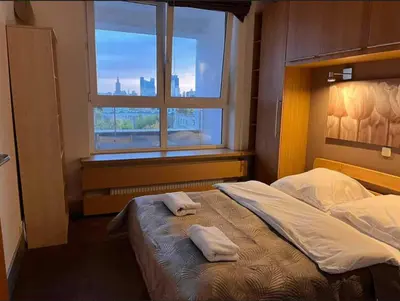 Łóżko lub łóżka w pokoju w obiekcie Duży Apartament przy Starym Mieście