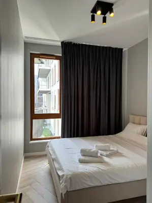 Łóżko lub łóżka w pokoju w obiekcie Cozy Kingdom