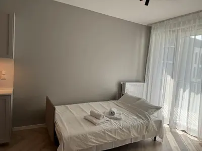 Łóżko lub łóżka w pokoju w obiekcie Cozy Kingdom