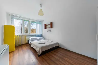 Łóżko lub łóżka w pokoju w obiekcie Cozy Apt. Arkadia/City Center