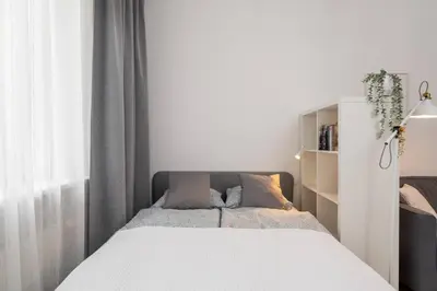 Łóżko lub łóżka w pokoju w obiekcie City Break Studio City Center Krucza