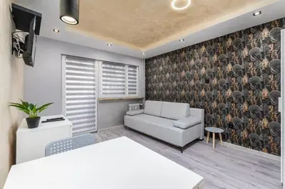 Łóżko lub łóżka w pokoju w obiekcie Czerniakowska 40 studio A