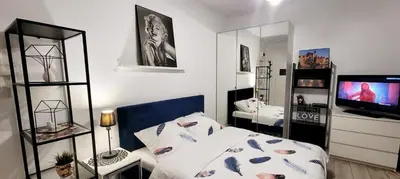 Łóżko lub łóżka w pokoju w obiekcie HomeComfort Apartament Merlin