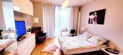Łóżko lub łóżka w pokoju w obiekcie HomeComfort Apartament Romantic Room