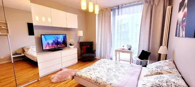 Telewizja i/lub zestaw kina domowego w obiekcie HomeComfort Apartament Romantic Room