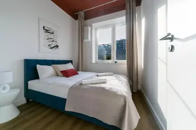 Łóżko lub łóżka w pokoju w obiekcie Warsaw Concierge Golden Hour