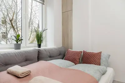 Łóżko lub łóżka w pokoju w obiekcie Daisy Studio Stary Mokotow