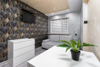 Łóżko lub łóżka w pokoju w obiekcie Czerniakowska 40 studio B