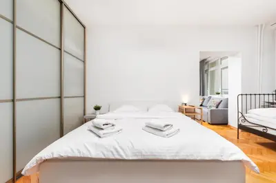 Łóżko lub łóżka w pokoju w obiekcie Apartament Wspólna by Your Freedom