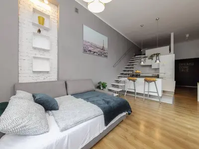 Łóżko lub łóżka w pokoju w obiekcie Graystone Studio Plac Unii Lubelskiej