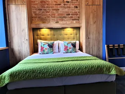 Łóżko lub łóżka w pokoju w obiekcie SleepWell Ordynacka
