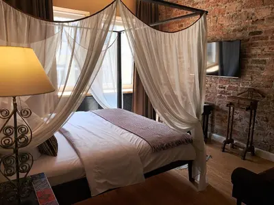 Łóżko lub łóżka w pokoju w obiekcie SleepWell Ordynacka