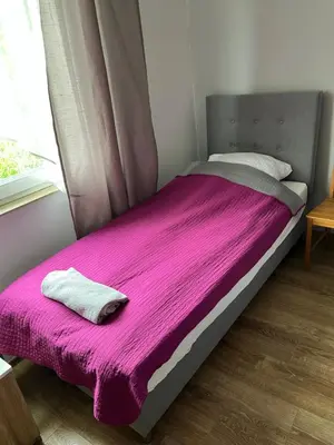 Łóżko lub łóżka w pokoju w obiekcie Fajna Kwatera Warszawa