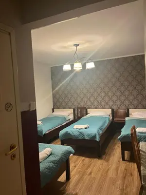 Łóżko lub łóżka w pokoju w obiekcie Fajna Kwatera Warszawa