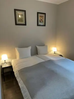 Łóżko lub łóżka w pokoju w obiekcie Cyprysowa Fine Apartment