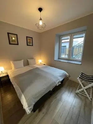 Łóżko lub łóżka w pokoju w obiekcie Cyprysowa Fine Apartment