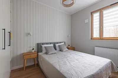 Łóżko lub łóżka w pokoju w obiekcie Expo Apartment Kolejowa