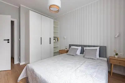 Łóżko lub łóżka w pokoju w obiekcie Expo Apartment Kolejowa