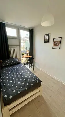 Łóżko lub łóżka w pokoju w obiekcie Rooms in Warsaw - G5