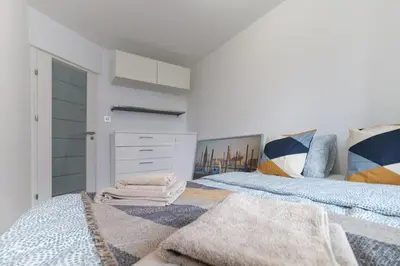 Łóżko lub łóżka w pokoju w obiekcie Home Dream Apartamenty Królewska 43