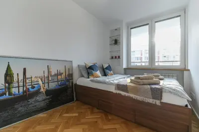 Łóżko lub łóżka w pokoju w obiekcie Home Dream Apartamenty Królewska 43