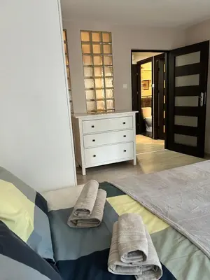 Łóżko lub łóżka w pokoju w obiekcie Apartment Moniuszki Dworzec Centralny